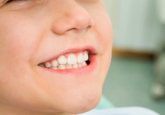 Close-up of little boy smiling at dentist office