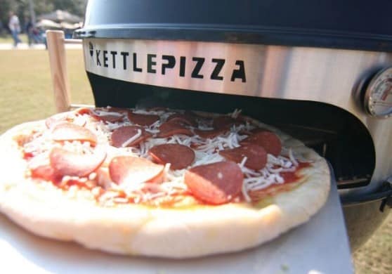 Make wood fired pizza at home with the KettlePizza Outdoor Pizza Kit Made in the USA
