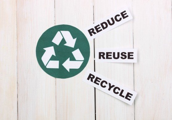 Recycling sign on wooden background