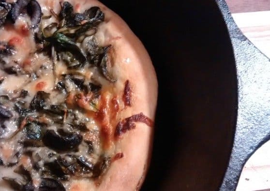 Spinach pizza baked in a Lodge cast iron skillet #nationalSpinachDay 