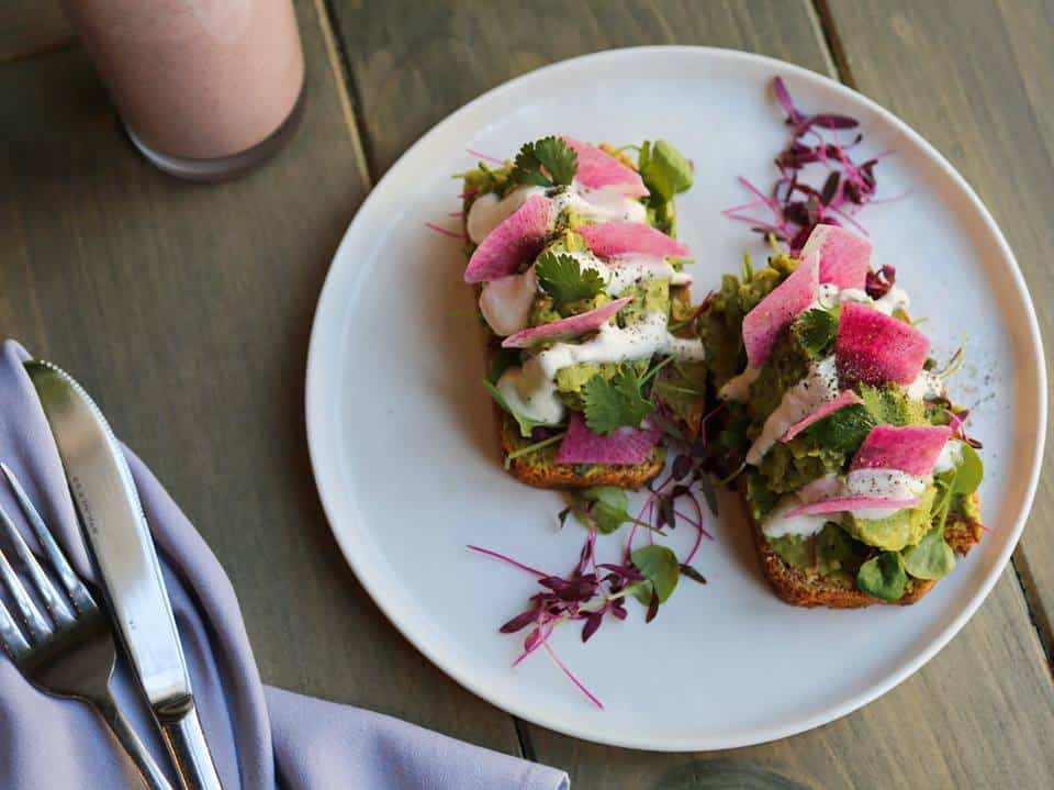 Best Vegan Restaurants in NYC: Avocado Toast with Watermelon Radish, Cashew Sour Cream, and Micro Greens - Divya's Kitchen - Vegan and Ayuvedic Restaurant in NYC #Ayuvedic #veganeats #avocado #avocadotoast #vegan #nycvegan #veganeats