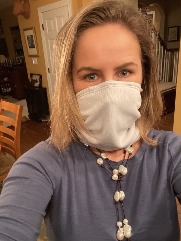 USA Love List founder Sarah Wagner wearing her favorite American made Tuga Sunwear neck gaiter mask (available on Amazon) and West Main Pearls.